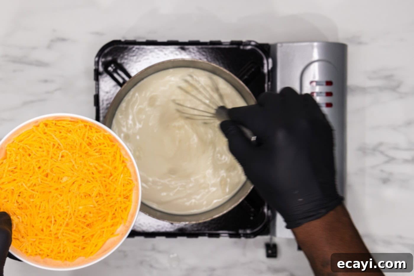 Set It and Forget It Scalloped Potatoes 8 whisking heavy whipping cream mixture in a saucepan while adding cheese