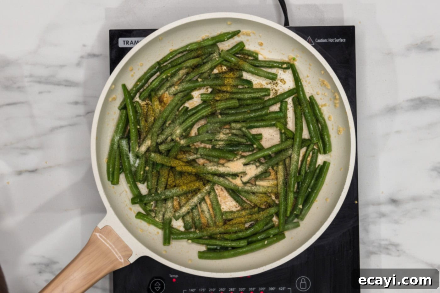 Garlic Sauteed Green Beans 6 green beans in a skillet with sesame oil and seasonings