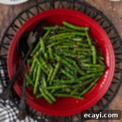 Garlic Sauteed Green Beans 10 Close up photo of Sautéed Green Beans on a red plate
