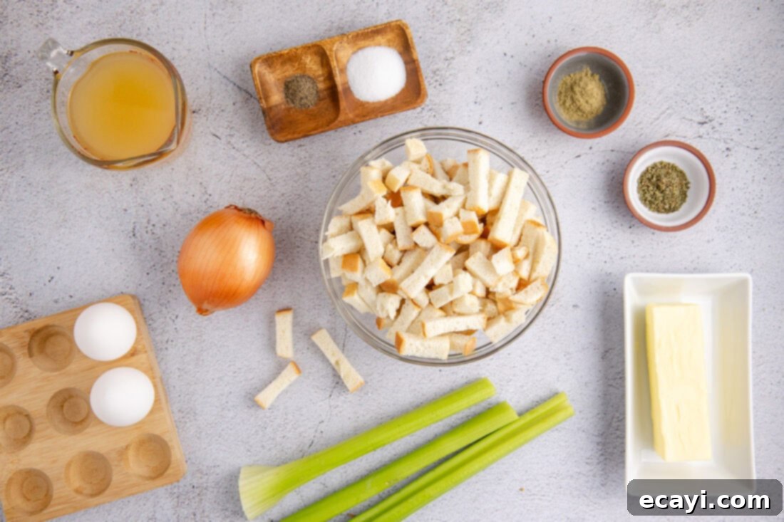 Easy Crockpot Stuffing 4 Ingredients for Crockpot Stuffing laid out on a table, including bread cubes, celery, onions, herbs, and broth.