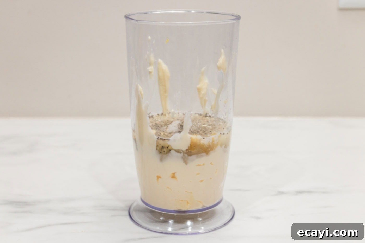 Creamy Garlic Aioli 5 All garlic aioli ingredients gathered in a bowl, ready for blending with an immersion blender.