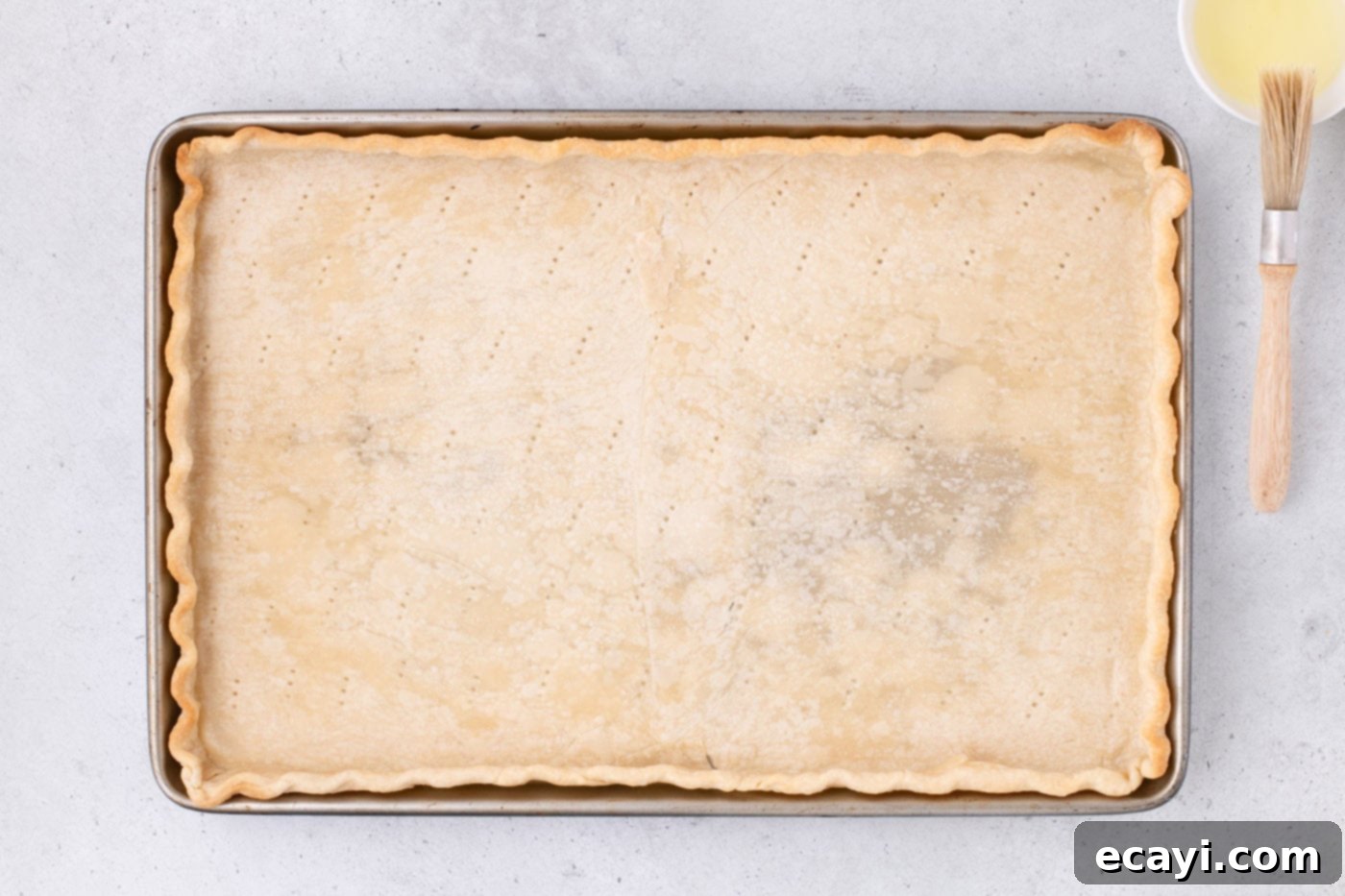 Family Sized Sheet Pan Pumpkin Pie 15 par baked pie crust in a jelly roll pan