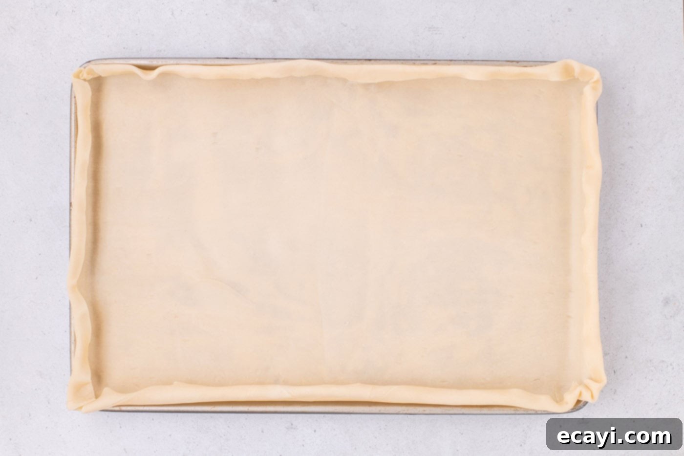 Family Sized Sheet Pan Pumpkin Pie 9 pie dough folded over edges of jelly roll pan