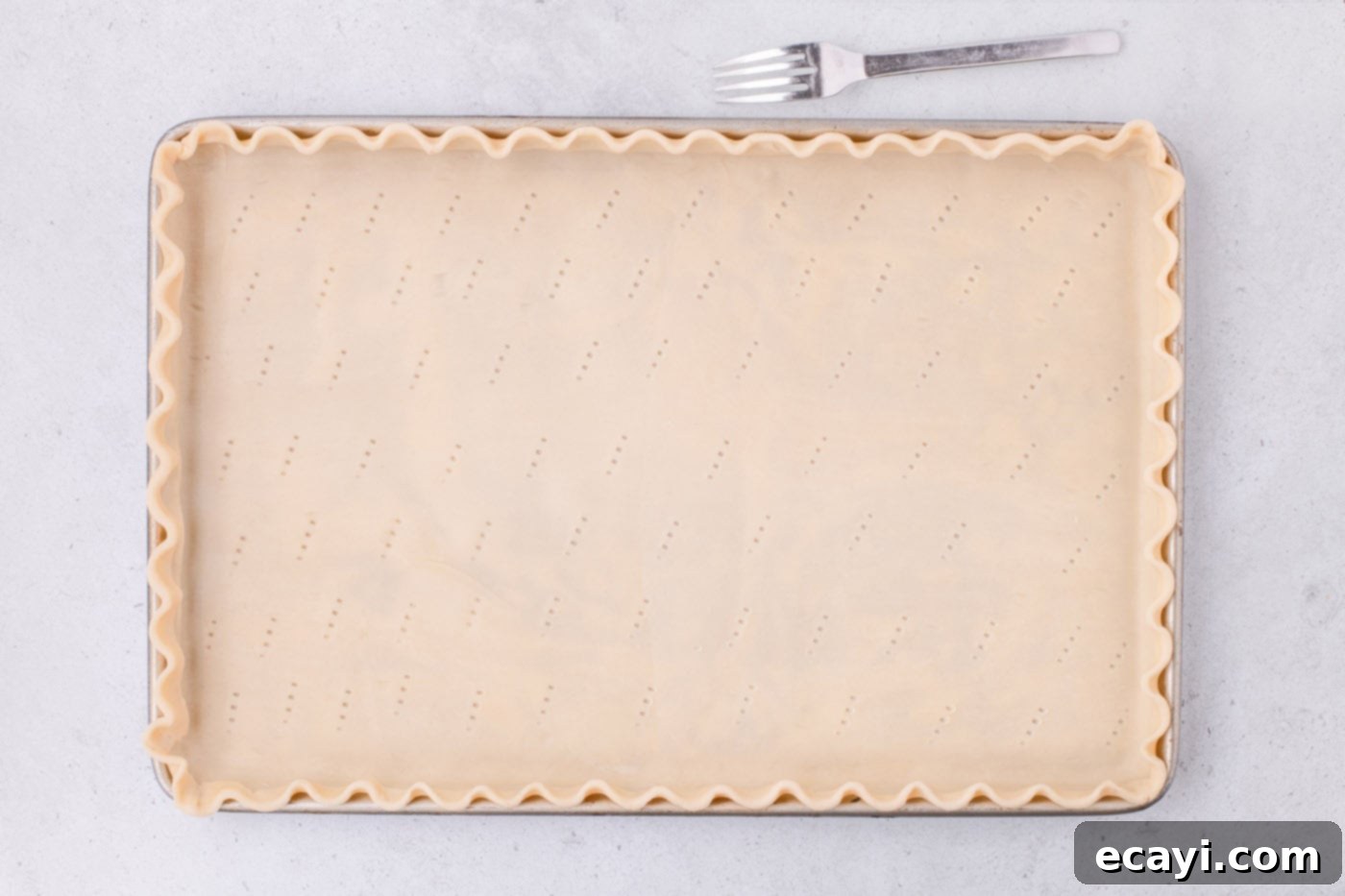 Family Sized Sheet Pan Pumpkin Pie 10 scalloped pie dough in a jelly roll pan
