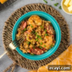 Easy Instant Pot Jambalaya 14 Close up photo of a bowl of Instant Pot Jambalaya with a fork resting on the side