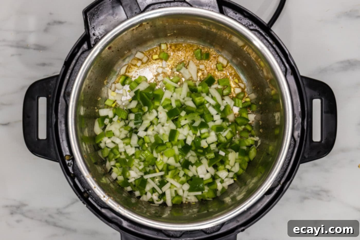 Easy Instant Pot Jambalaya 8 celery, bell peppers, and onion sauteed in an instant pot
