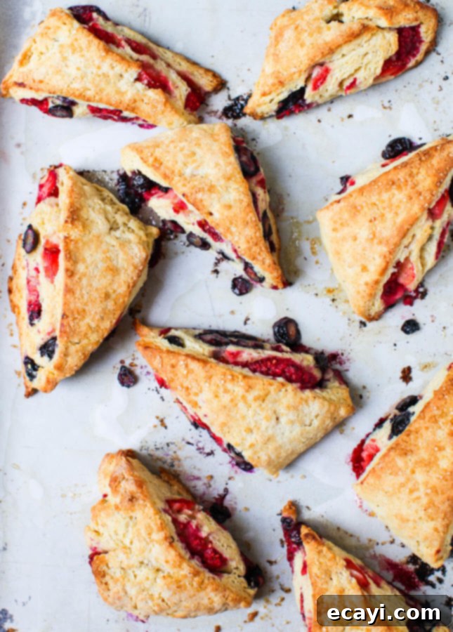 Fluffy Triple Berry Scones 2 Delicious Triple Berry Scones by Simple Bites, perfectly flaky and golden brown