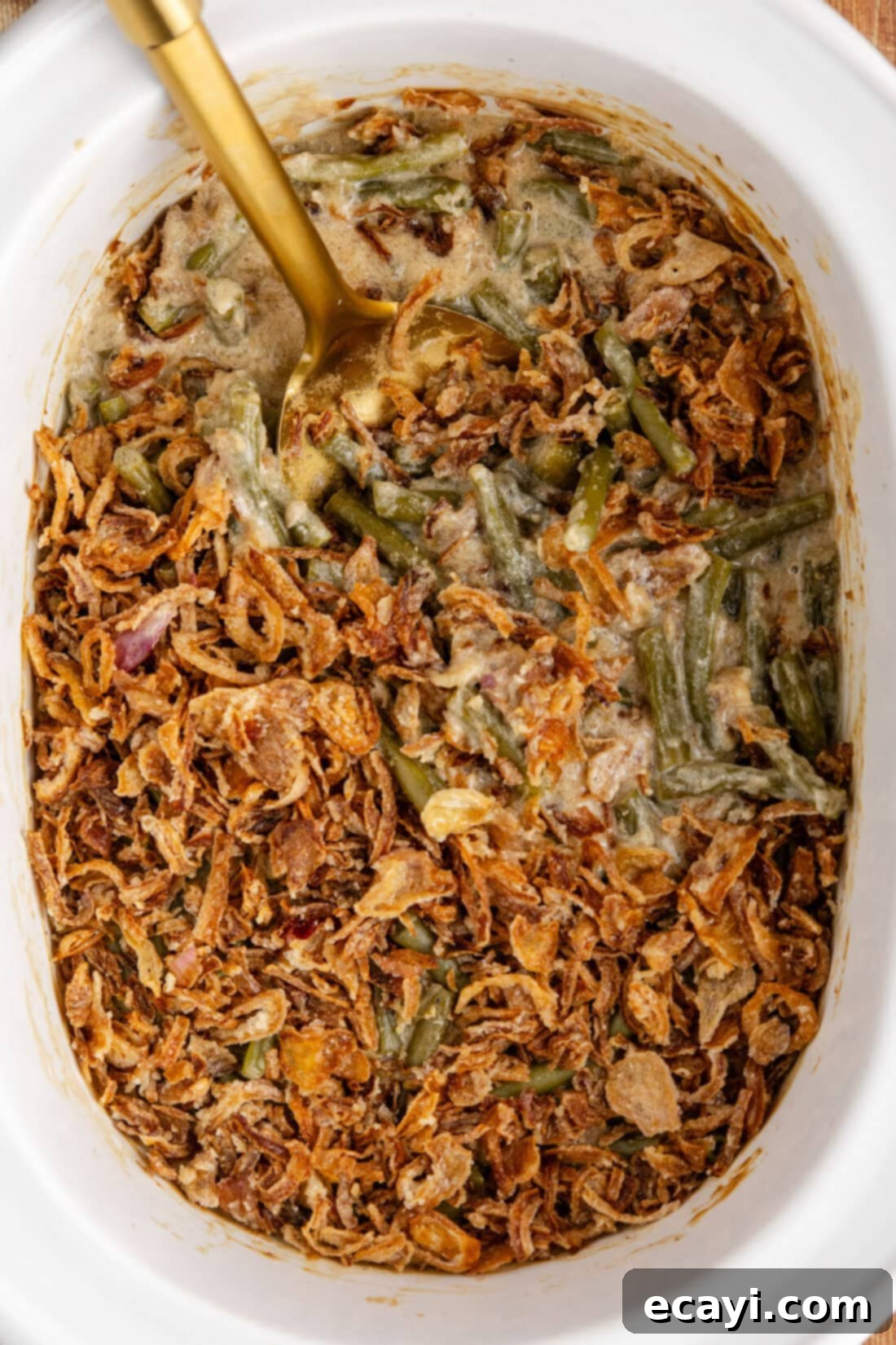 Effortless Crockpot Green Bean Bake 3 Close up photo of Green Bean Casserole in a crockpot, showing steam rising and the rich, creamy sauce.