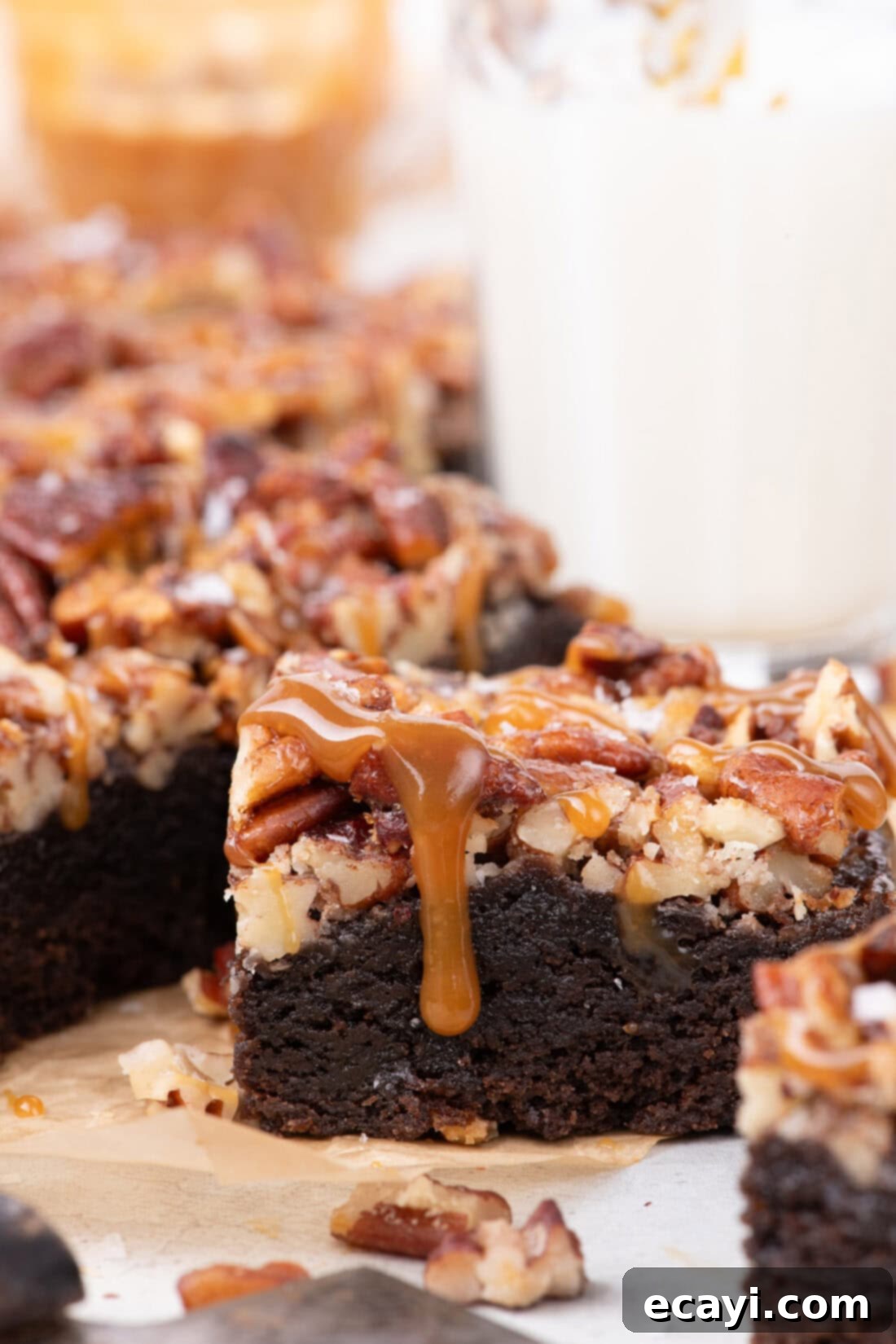 Decadent Pecan Pie Brownies 11 Close up photo of a single Pecan Pie Brownie, showing its rich, fudgy base and glistening pecan topping