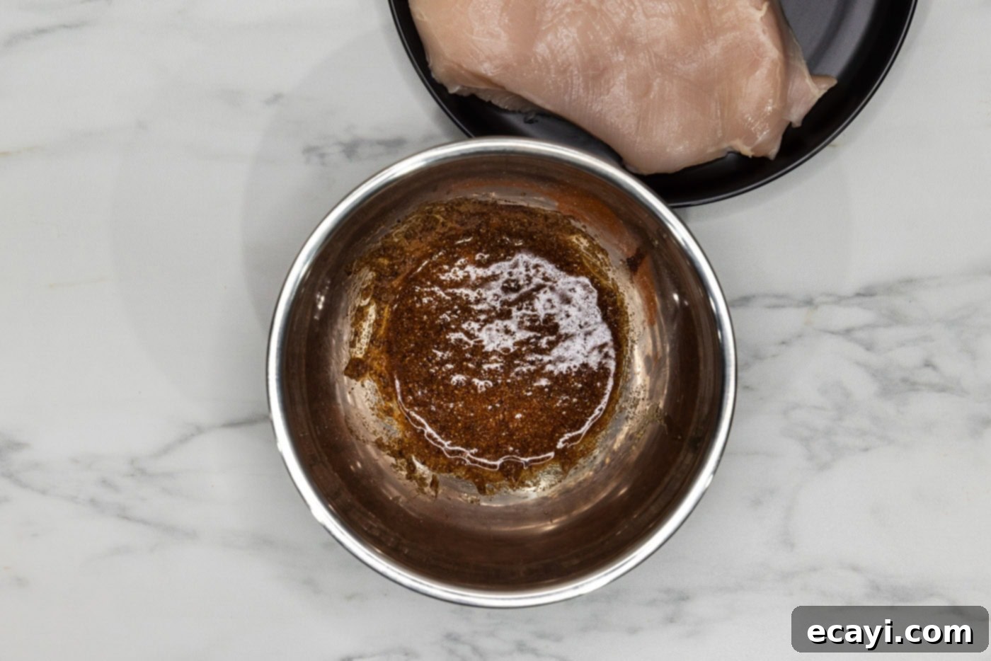 Flawless Sous Vide Chicken Breast 5 olive oil mixed with spices and seasonings in a bowl