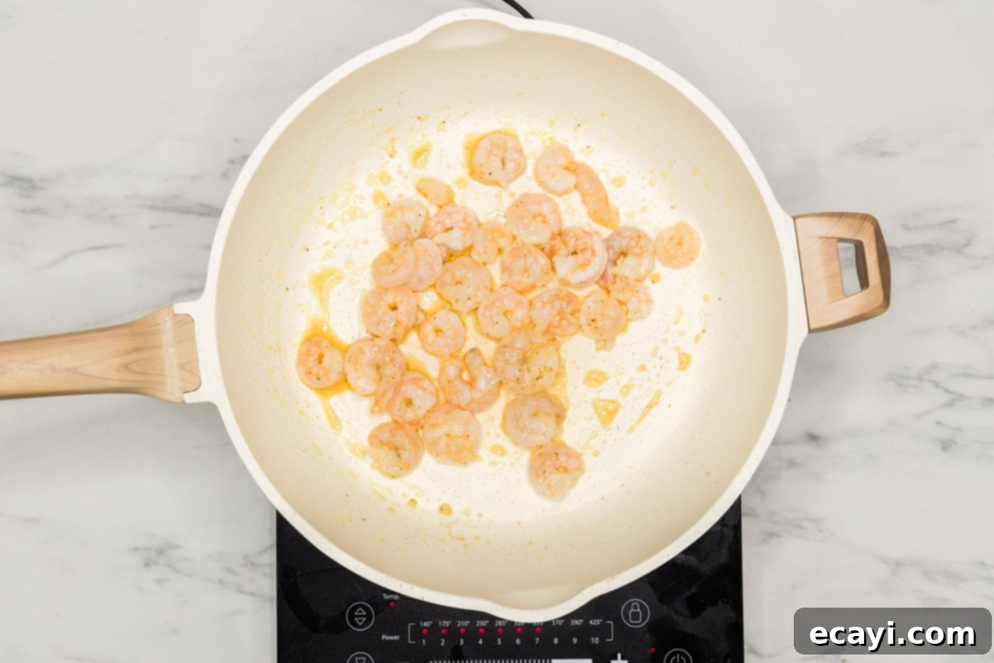Prawn Spring Rolls 5 small shrimp in a skillet