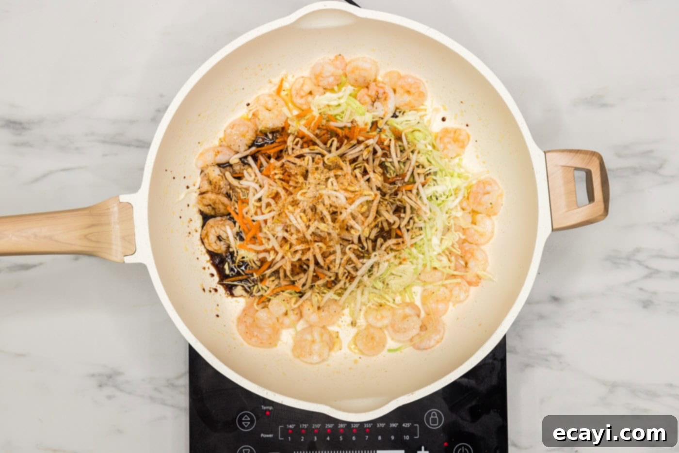 Prawn Spring Rolls 6 soy sauce added to skillet with shrimp, bean sprouts, carrots, and cabbage