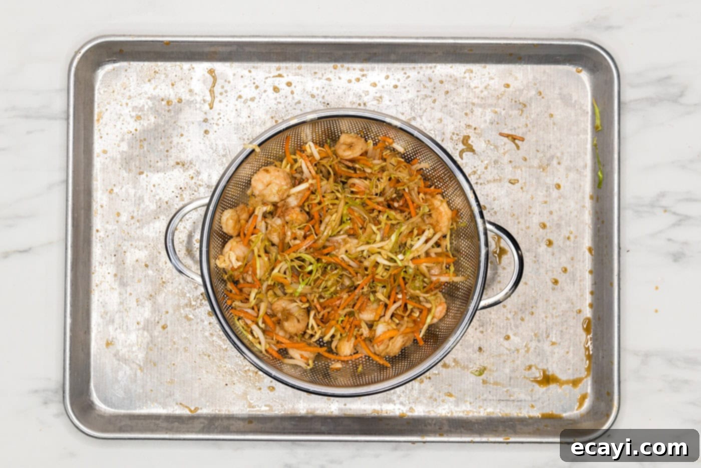 Prawn Spring Rolls 8 egg roll filling draining in a colander