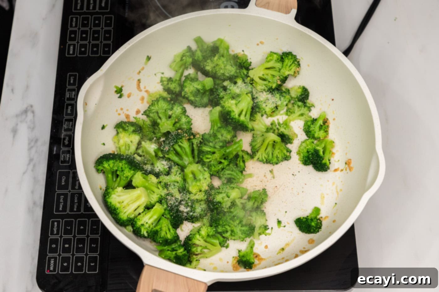 Creamy Broccoli Pasta 6 broccoli florets in a skillet with garlic