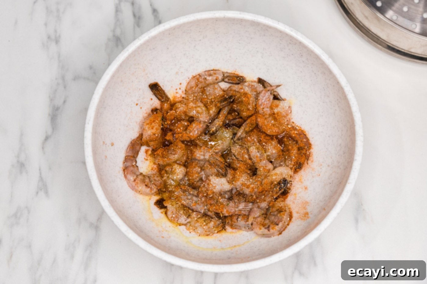 Tender Steamed Shrimp 5 shrimp in a bowl with old bay seasoning
