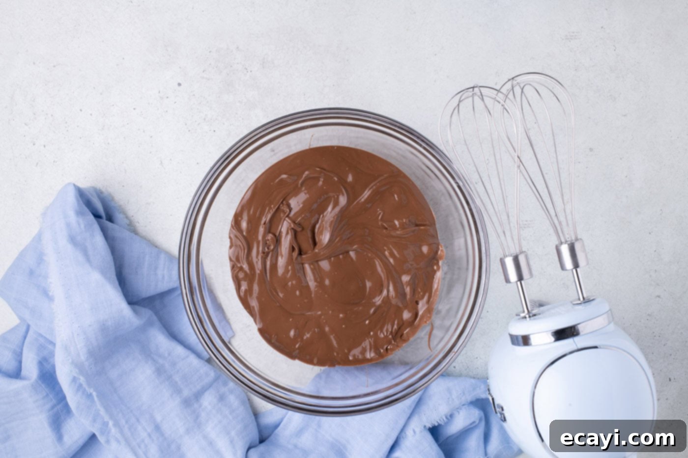 Cool Whip Treats 5 A bowl of melted milk chocolate, smooth and glossy.