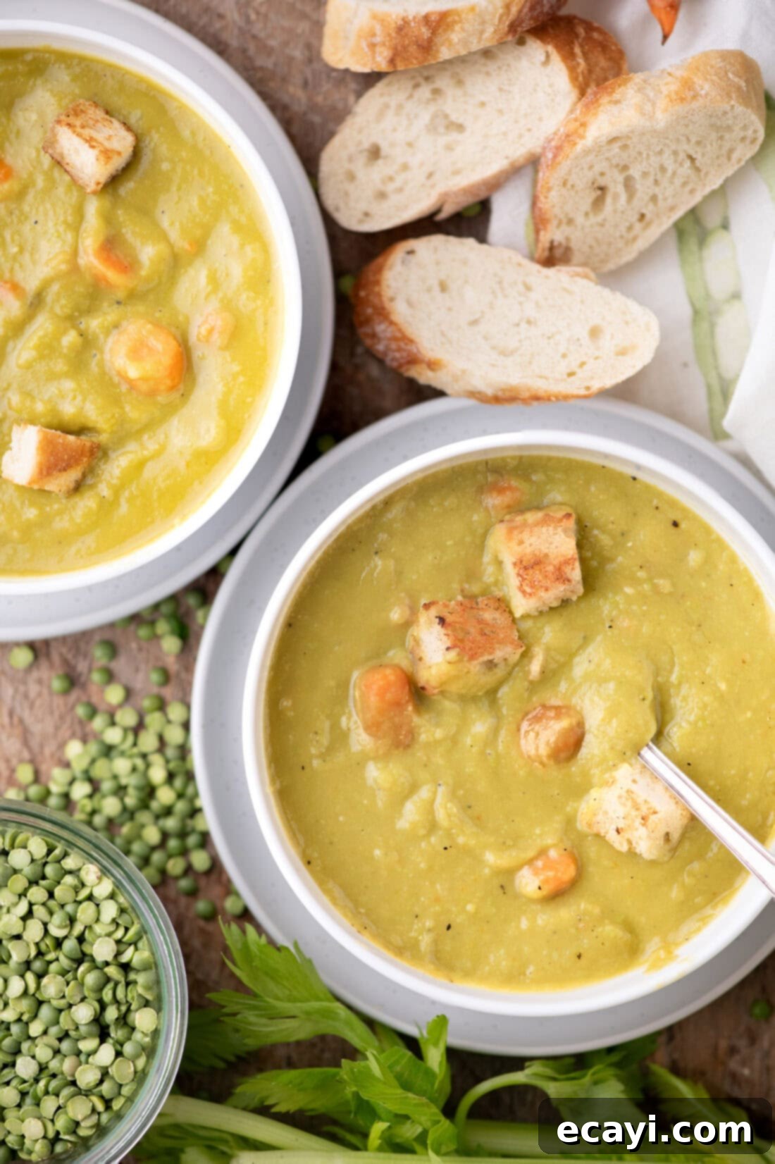 Hearty Instant Pot Split Pea Soup 2 Two bowls of Instant Pot Split Pea Soup with crusty bread on the side, ready to be served, highlighting the soup's comforting appeal.