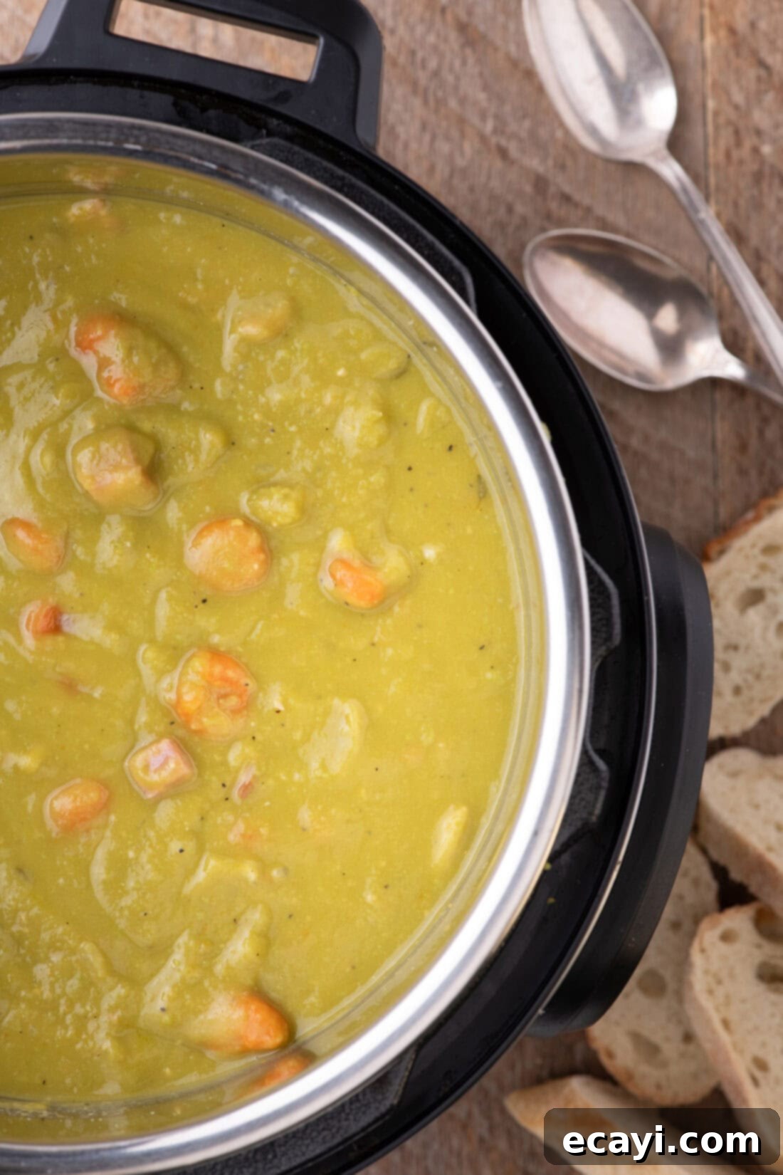 Hearty Instant Pot Split Pea Soup 3 A close-up photo of a gleaming Instant Pot filled with the rich, green Instant Pot Split Pea Soup, highlighting its hearty texture.