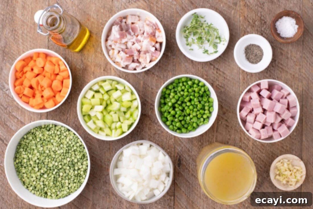 Hearty Instant Pot Split Pea Soup 4 A vibrant flat lay of all fresh ingredients for Instant Pot Split Pea Soup, including bacon, ham, dried peas, chopped vegetables, and thyme sprigs.