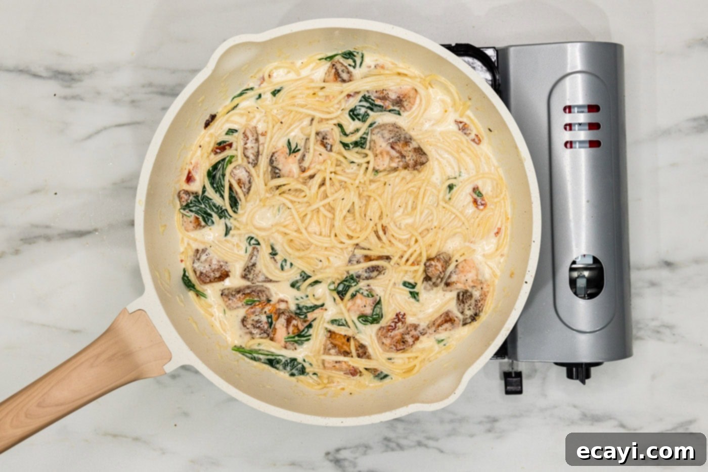 Mediterranean Salmon Pasta 10 salmon pasta in a skillet with cream sauce