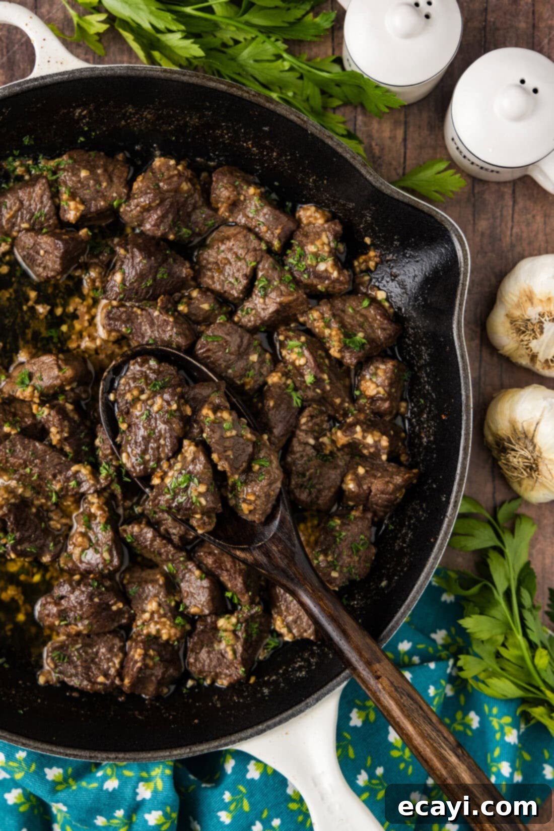 Mouthwatering Garlic Butter Steak Bites 2 Close up photo of Garlic Butter Steak Bites in a skillet, glistening with a rich, golden garlic butter sauce, ready to be served.
