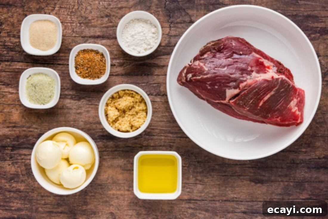 Mouthwatering Garlic Butter Steak Bites 4 A flat lay photograph displaying all the fresh ingredients required for making Garlic Butter Steak Bites, including sirloin steak, butter, garlic, olive oil, and various seasonings.