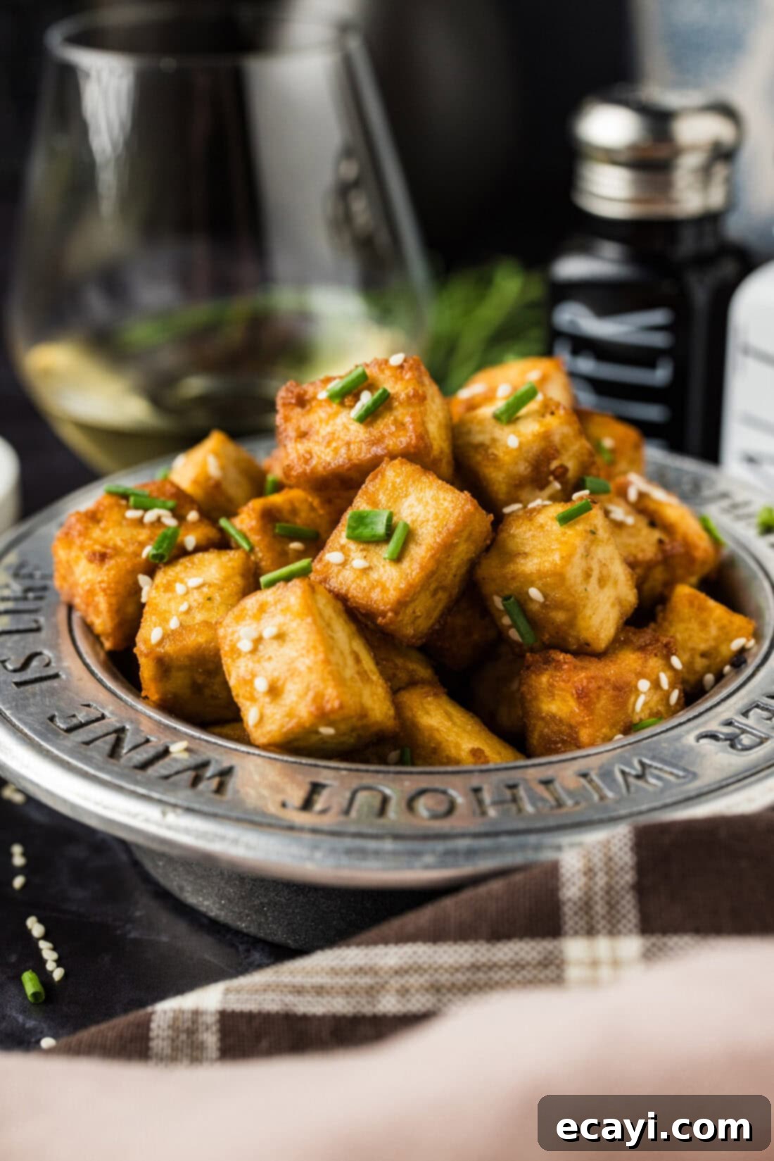 Crispy Golden Tofu 2 Crispy golden fried tofu cubes seasoned with umami soy sauce, ready to be served in an appetizer bowl, showcasing perfect texture for a delicious vegan dish.
