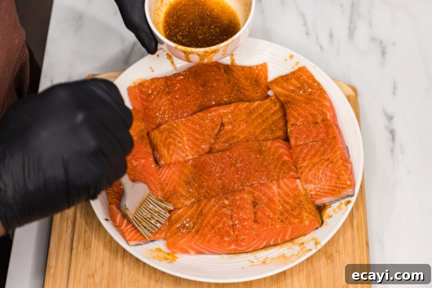 Silken Salmon Perfection 5 basting salmon filets with olive oil and seasonings