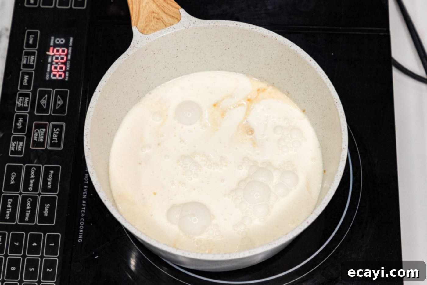 Silken Salmon Perfection 6 heavy cream adding to skillet with wine and garlic