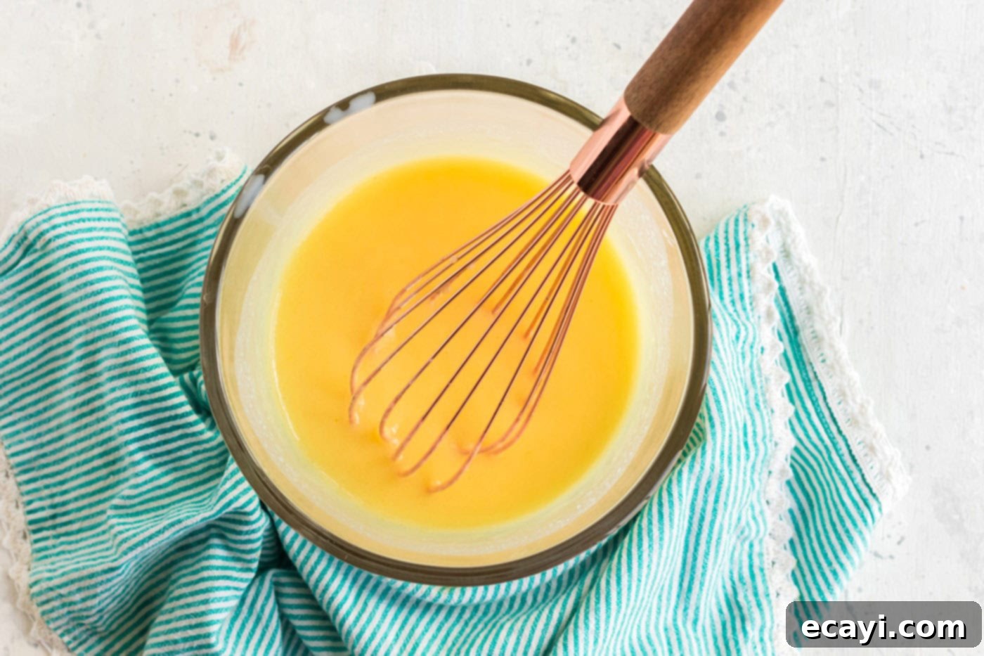 Effortless Banana Cake 8 banana pudding mix being whisked into milk in a bowl