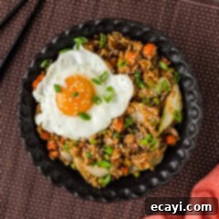 Savory Korean Fried Rice 11 A beautifully presented bowl of Korean Fried Rice with a runny fried egg on top
