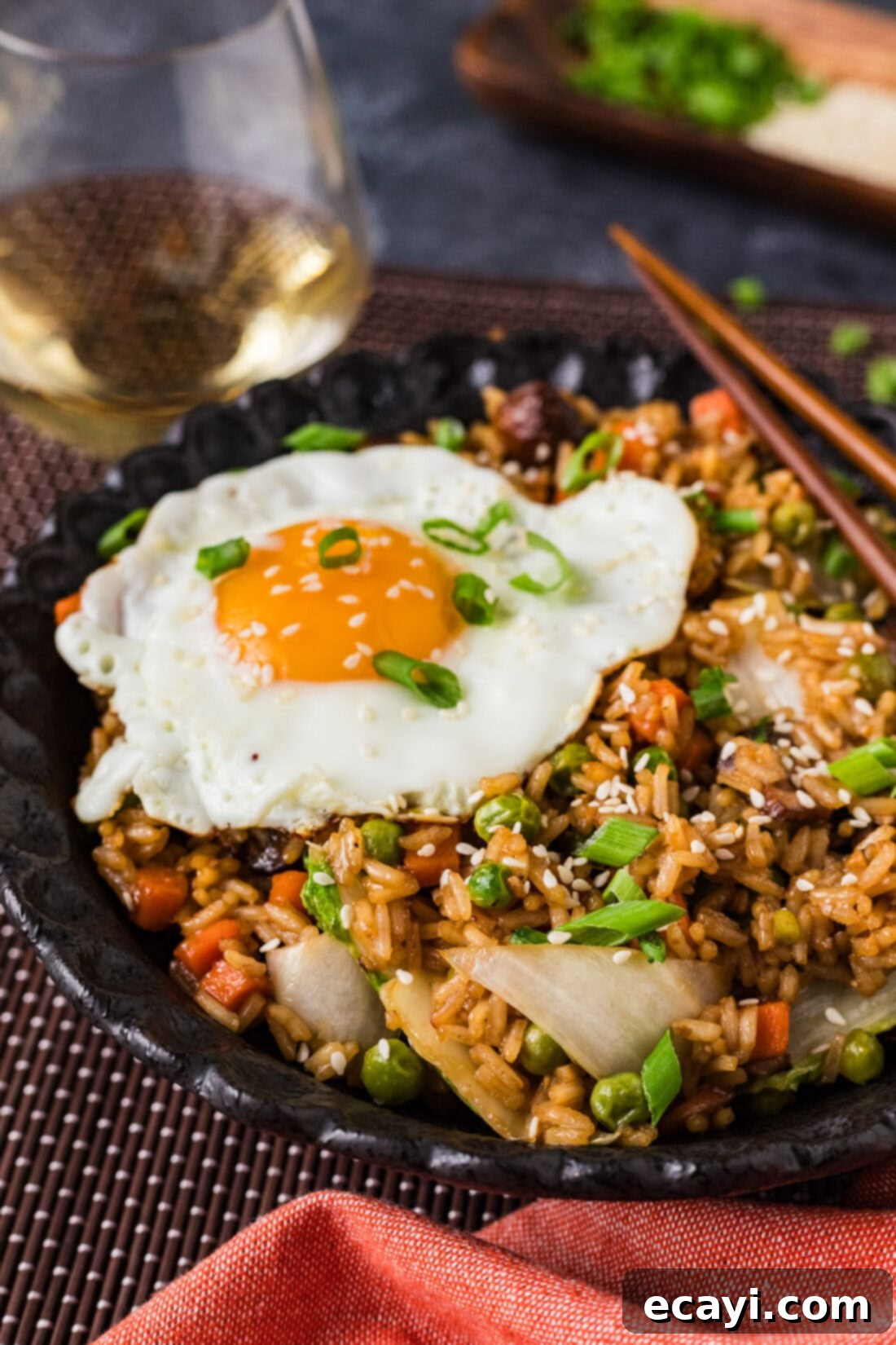 Savory Korean Fried Rice 10 Close up side photo of a bowl of Korean Fried Rice, showing the textures of rice, vegetables, and egg