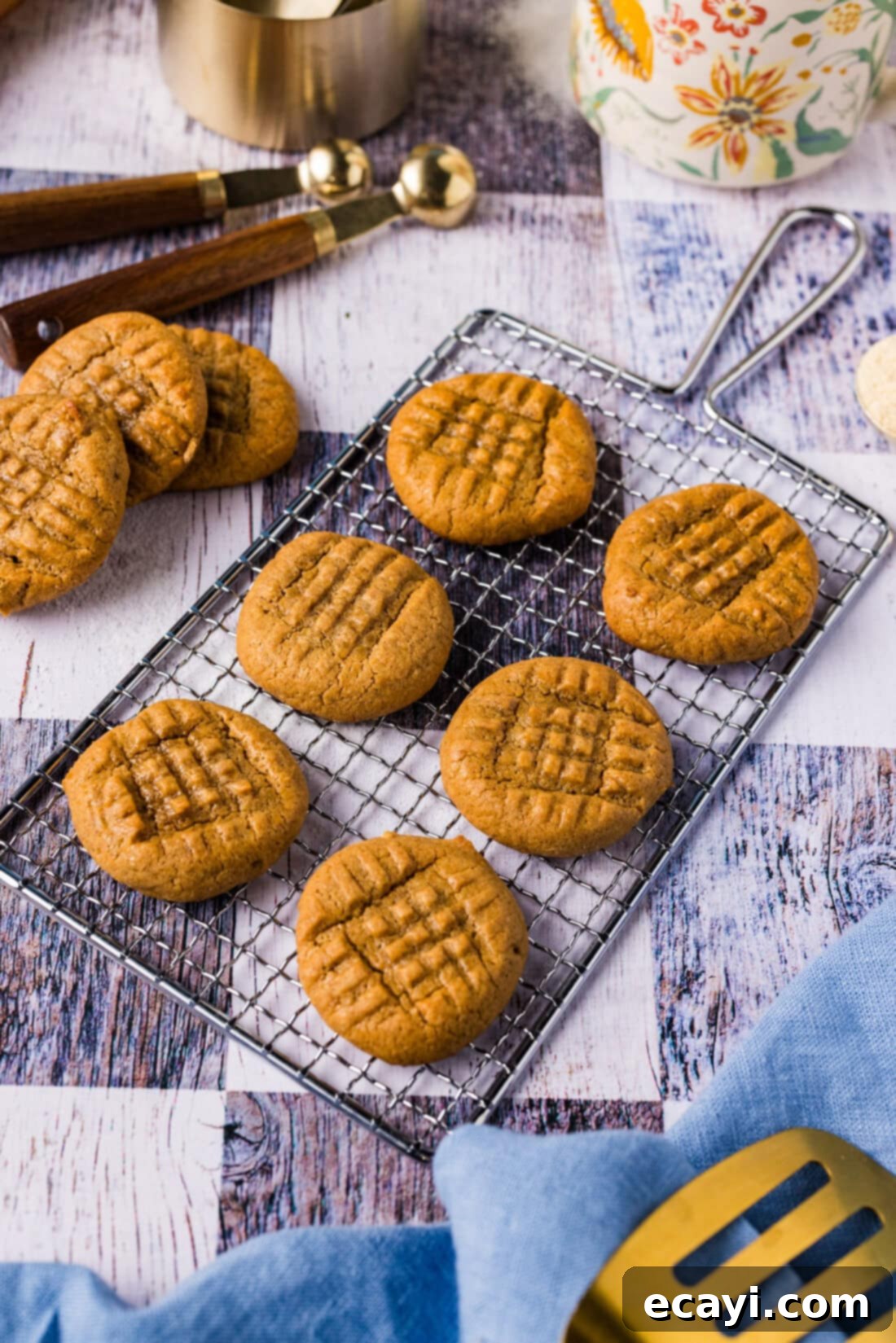 Guilt-Free Keto Peanut Butter Treats 3 Keto Peanut Butter Cookies resting on a safety grater, highlighting their rustic charm