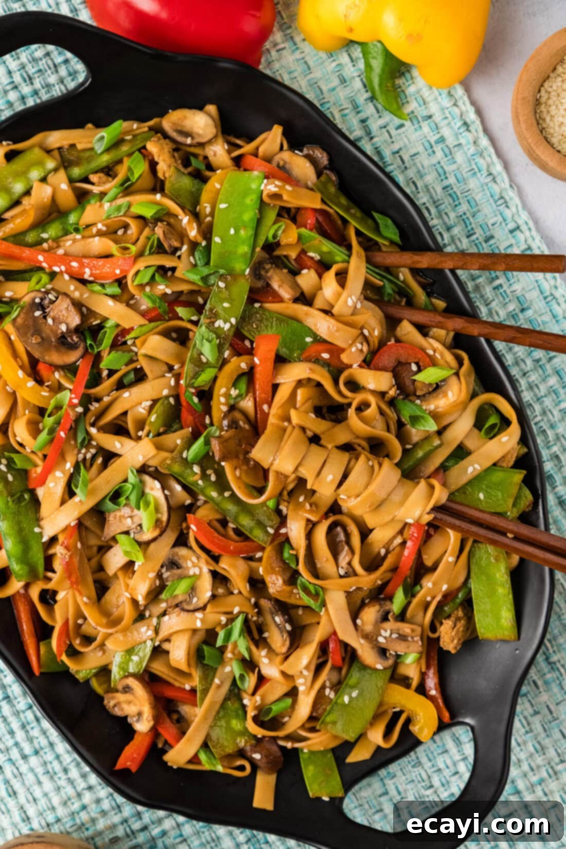 Savory Vegetable Lo Mein 2 Platter of homemade Vegetable Lo Mein with chopsticks resting in it, showcasing vibrant vegetables and perfectly cooked noodles