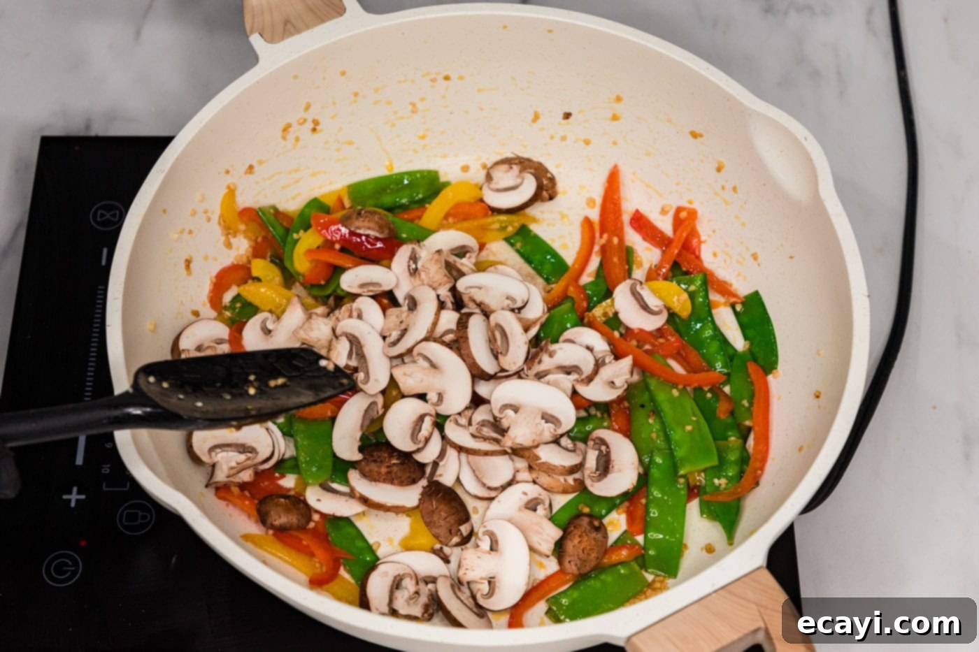 Savory Vegetable Lo Mein 6 Mushrooms, snow peas, and bell peppers in a skillet, pushed to one side