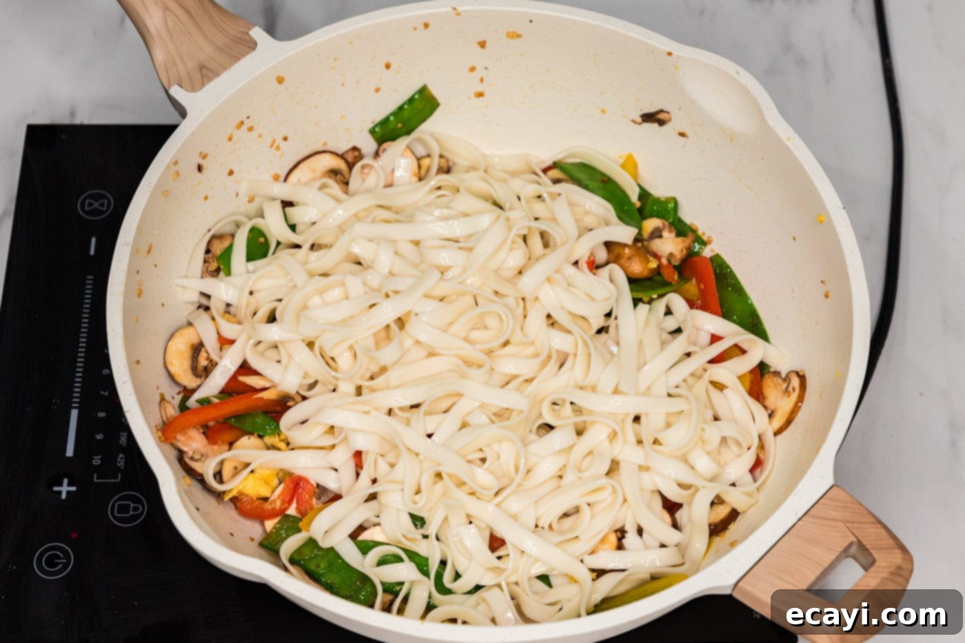 Savory Vegetable Lo Mein 8 Cooked lo mein noodles added to a skillet with stir-fried vegetables and scrambled egg