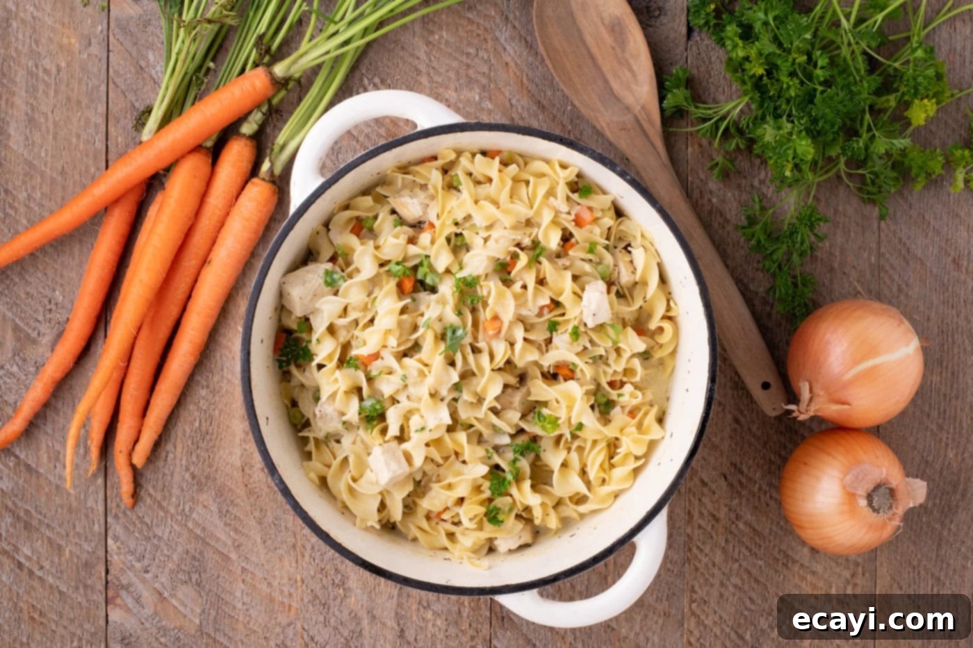 Hearty Chicken Pot Pie Pasta 11 overhead shot of finished chicken pot pie pasta in a pot, garnished with fresh parsley