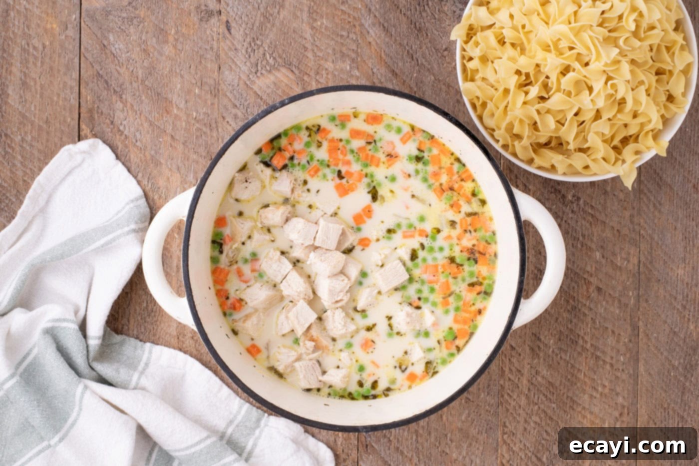 Hearty Chicken Pot Pie Pasta 10 cubed chicken and egg noodles added to the pot pie pasta mixture, stirring to combine