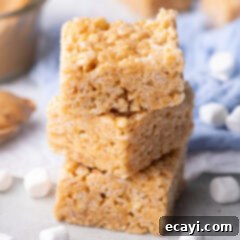 Crunchy Peanut Butter Krispie Delights 12 Close up photo of a stack of Peanut Butter Rice Krispie Treats, showing their texture and deliciousness.