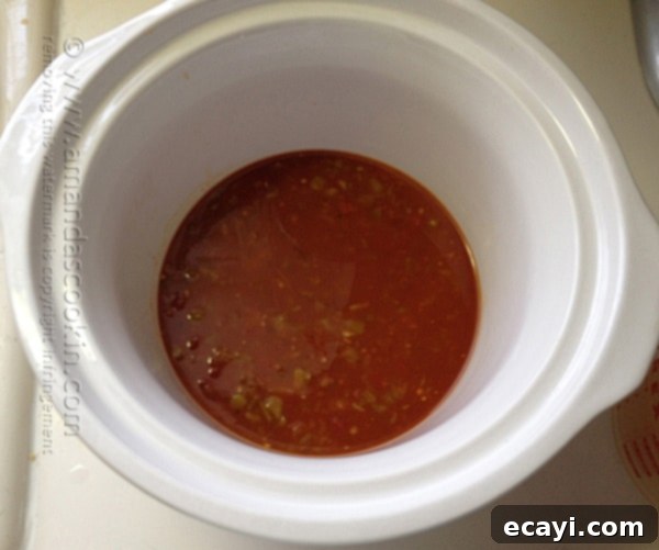 Vibrant Three Bean Salsa Chicken and Rice 5 combine salsa, broth and green chiles in crock pot