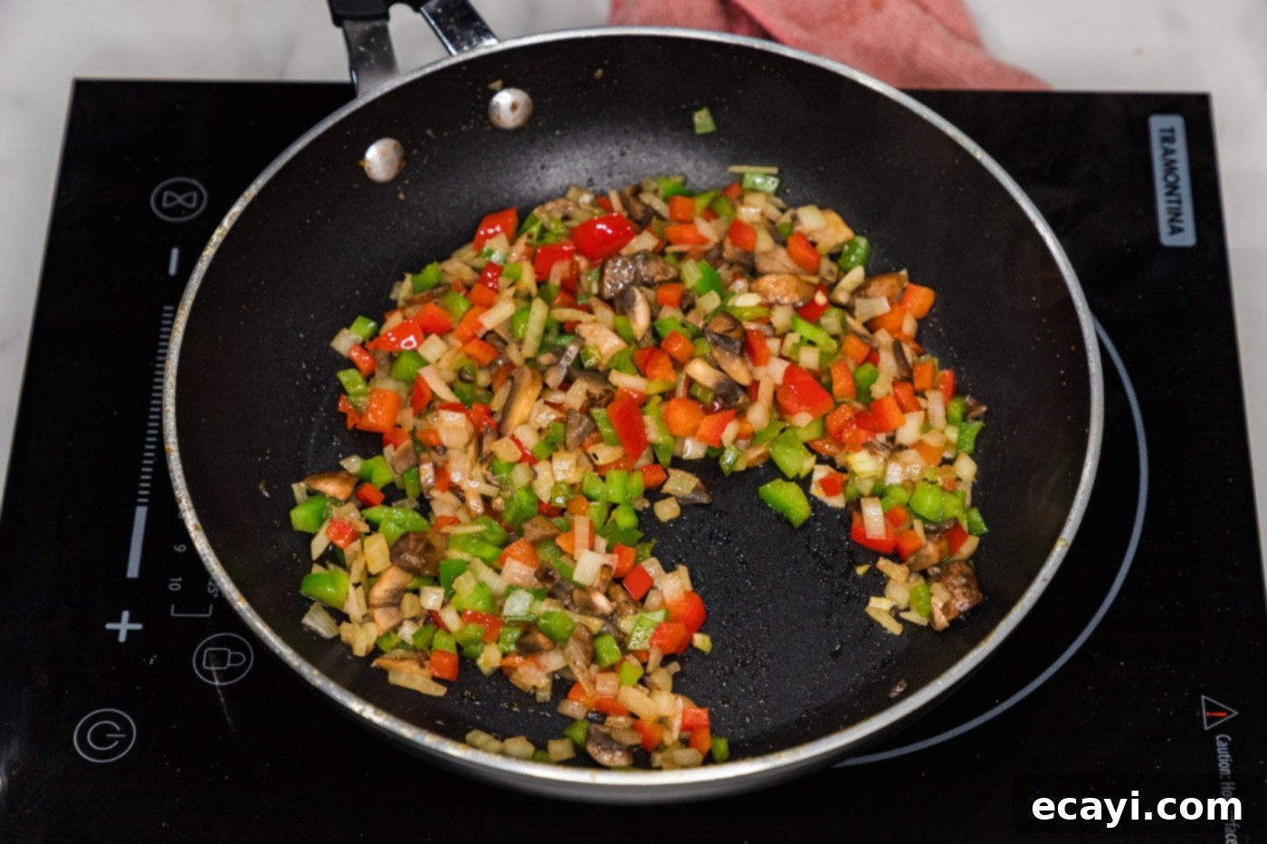 Crispy Philly Cheesesteak Rolls 7 sauteed veggies in a skillet