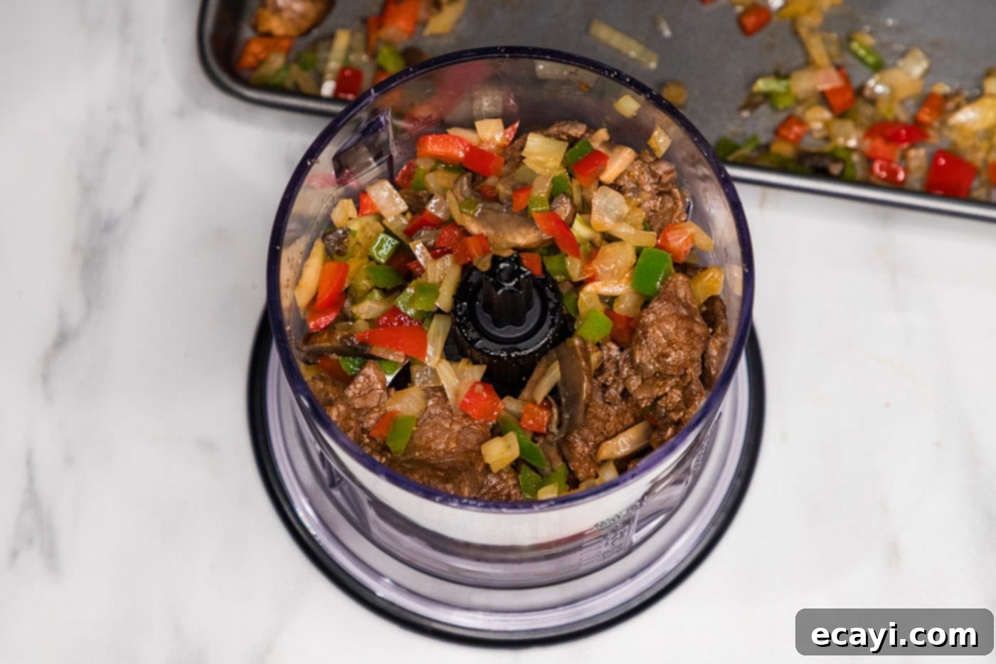 Crispy Philly Cheesesteak Rolls 8 veggies and meat mixture in a food chopper