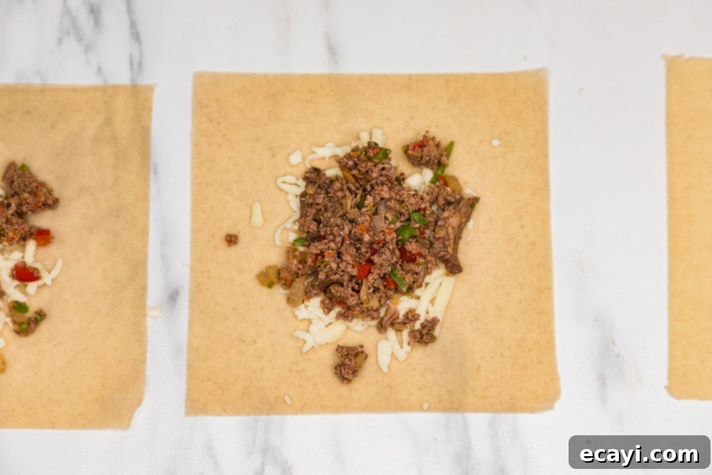 Crispy Philly Cheesesteak Rolls 10 meat mixture on top of egg roll wrapper