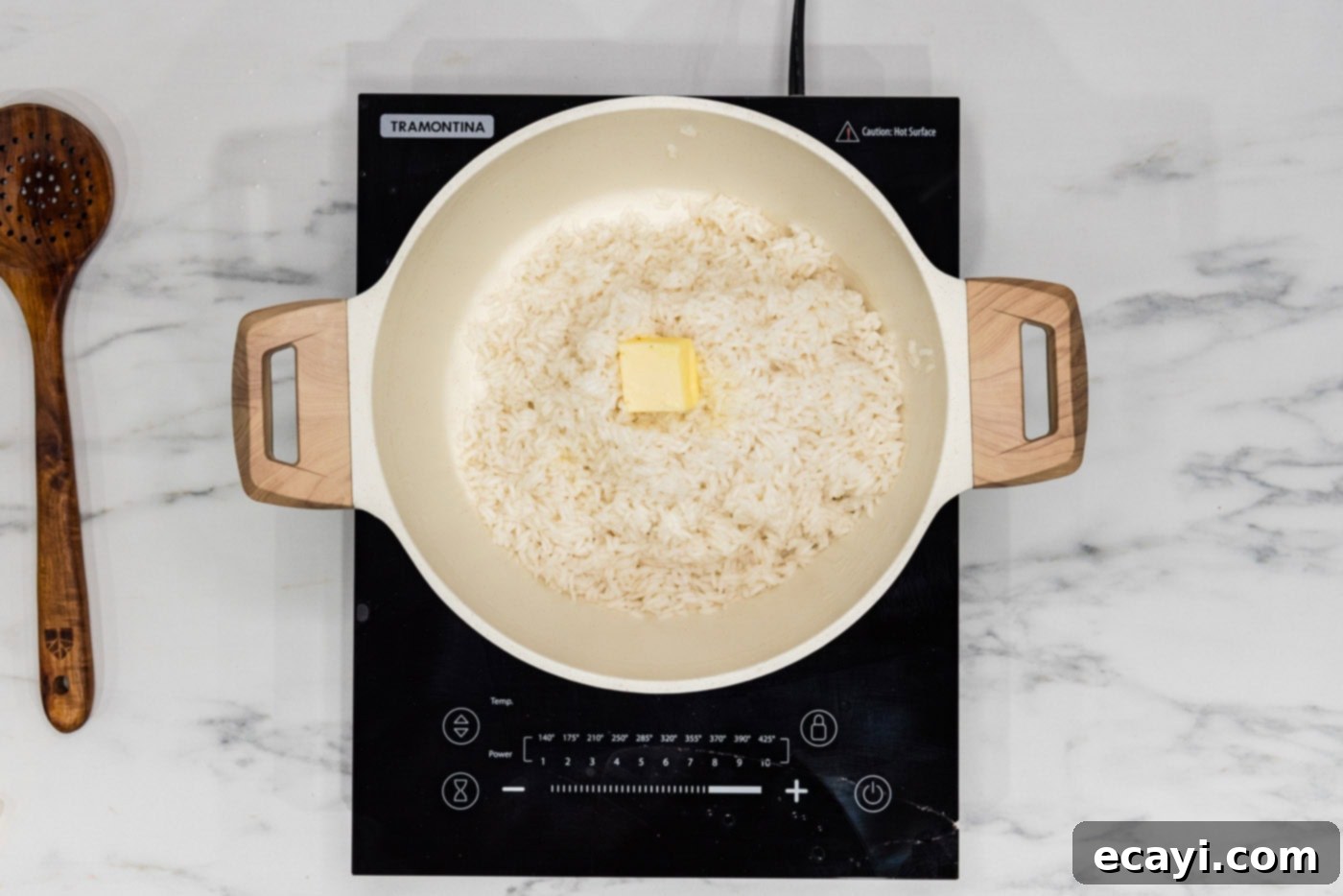Pasta-Style Rice 5 butter pat on top of rice in a pot