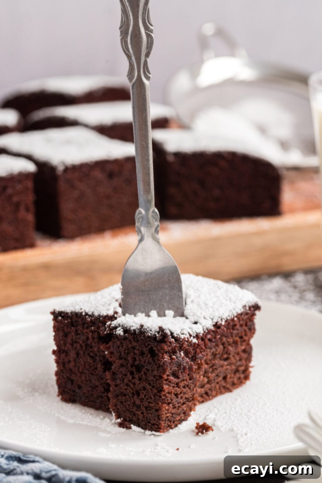 Miracle Mix Cake 2 Fork in a square of Wacky Cake