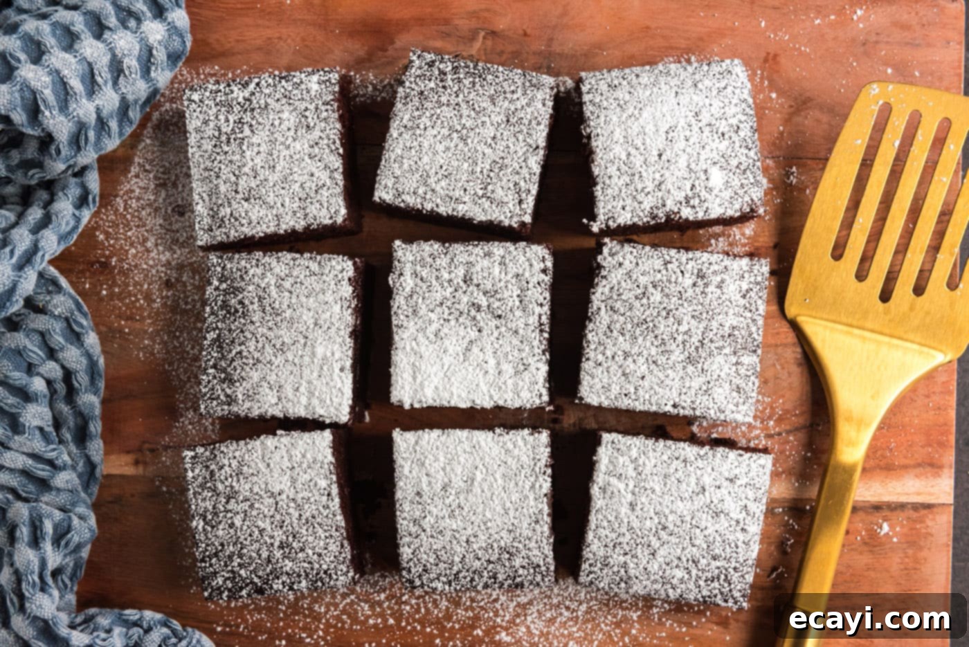 Miracle Mix Cake 14 sliced wacky cake with powdered sugar topping