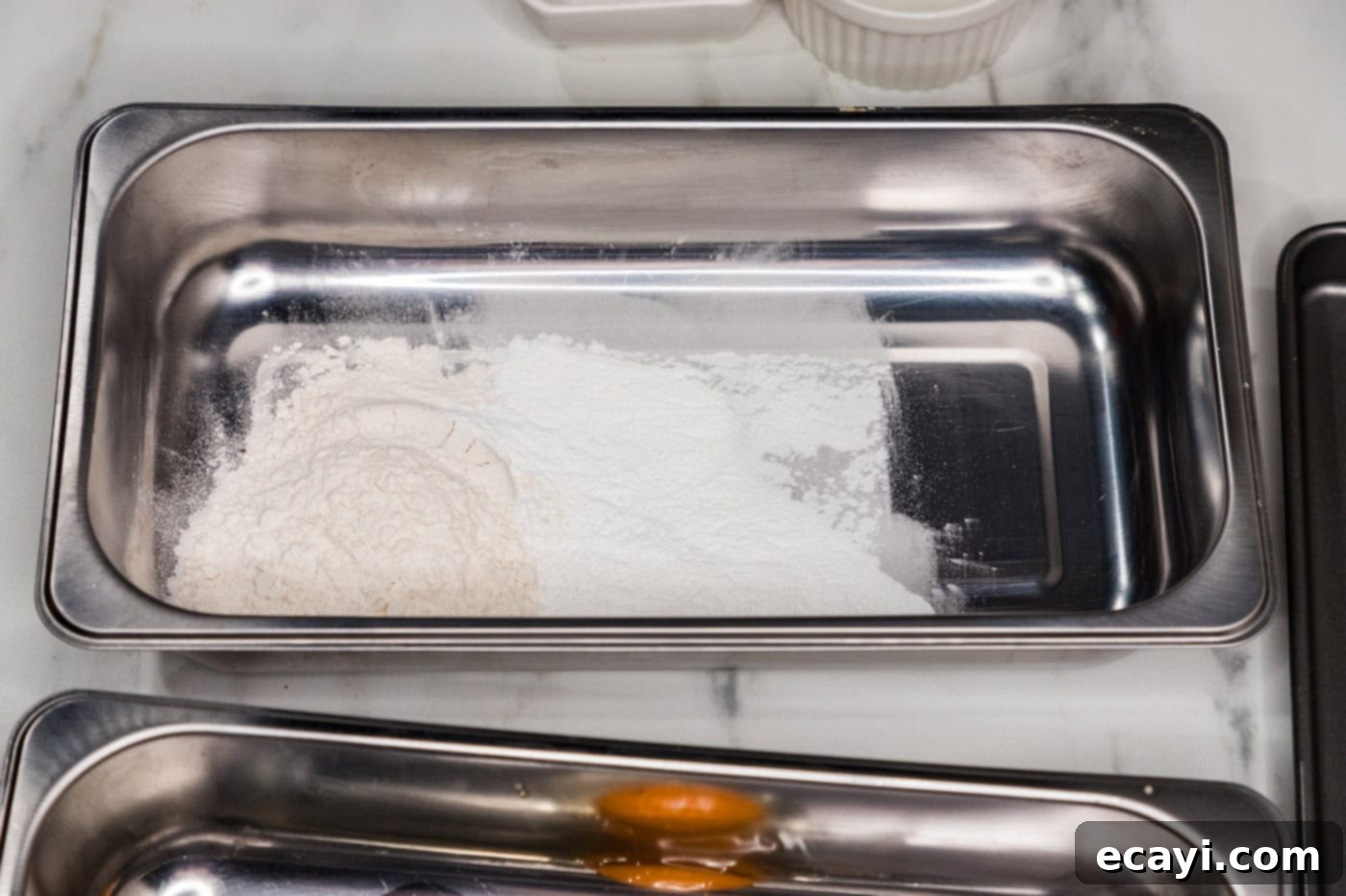 Golden Panko Chicken Cutlet 5 flour in a breading tray