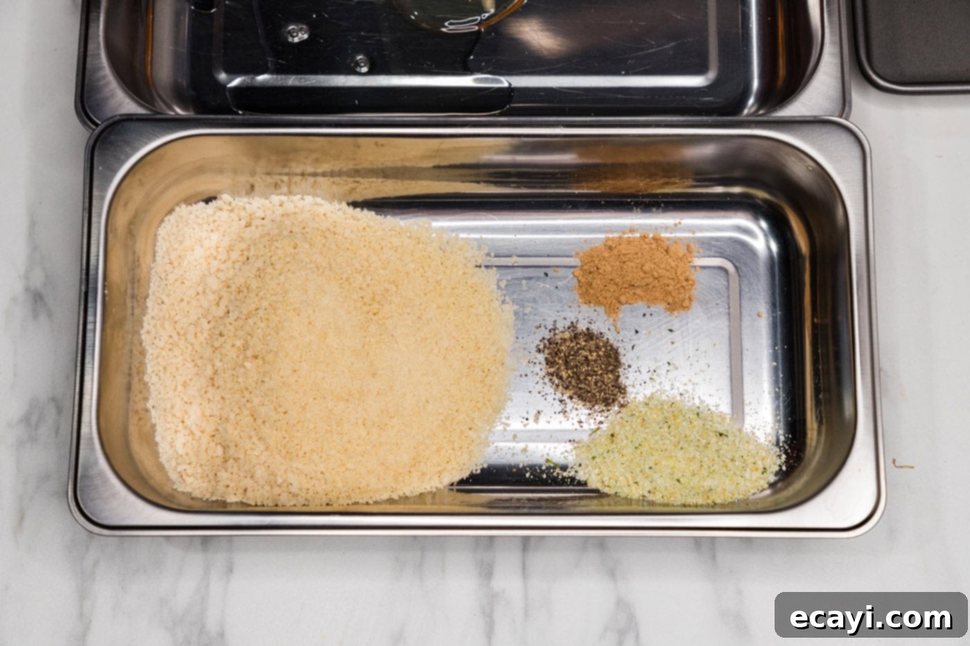 Golden Panko Chicken Cutlet 7 panko breadcrumbs and seasonings in a breading tray