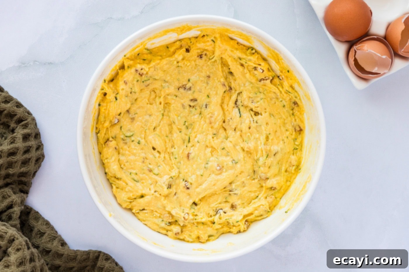 Quick Zucchini Muffins 6 zucchini muffin batter in a mixing bowl
