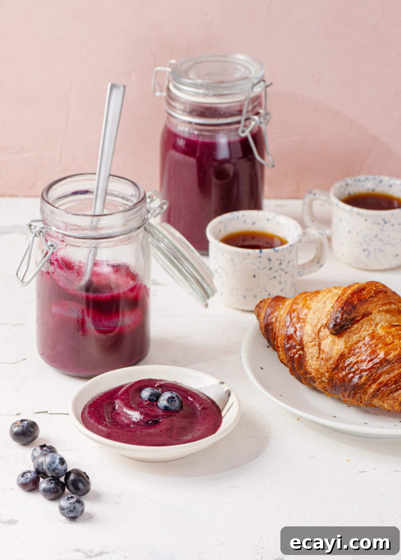 Velvety Blueberry Spread 2 Rich, vibrant homemade blueberry curd in a glass jar, perfect for breakfast and brunch.